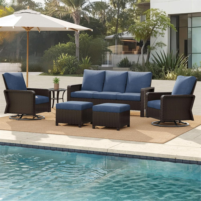 A Three-Seater Sofa + Two Swivel Chairs + Two Footstools + A Side Table