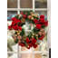 Couronne festive festive dorée et rouge avec ornements et rubans.