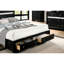 Grand lit en bois massif avec rangement en noir, aspect détente moderne