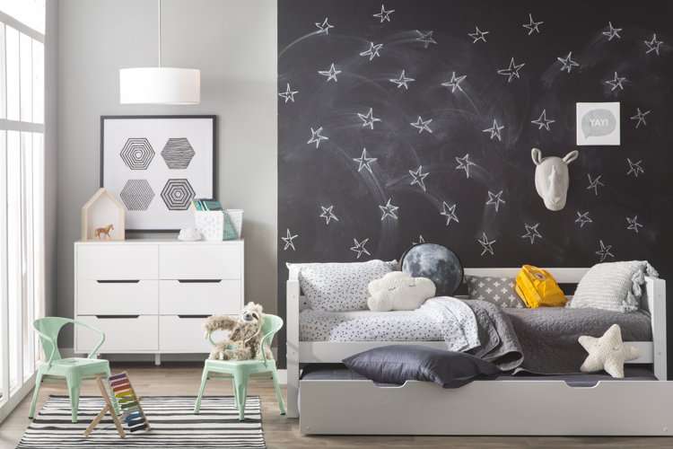 white trundle bed with modern bedding