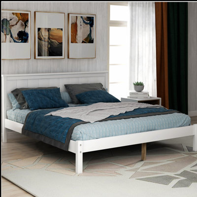 Élégante base de lit plateforme en bois avec tête de lit élégante, offrant confort et durabilité pour une bonne nuit de sommeil.