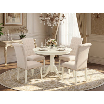 L'ensemble de mobilier de salle à manger 5 pièces comprend une table ronde avec piédestal et 4 chaises rembourrées en tissu de lin beige clair, lin blanc