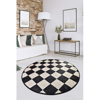 Tapis rond à carreaux tissé à plat en noir / blanc Tarun