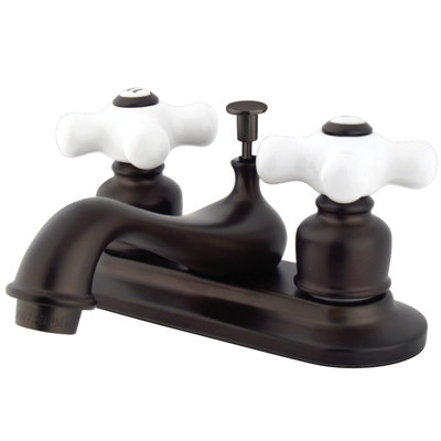 Kingston Brass Restoration Two-Handle 3-Hole Deck Mount 4" Centerset Bathroom Faucet with Plastic Pop-Up