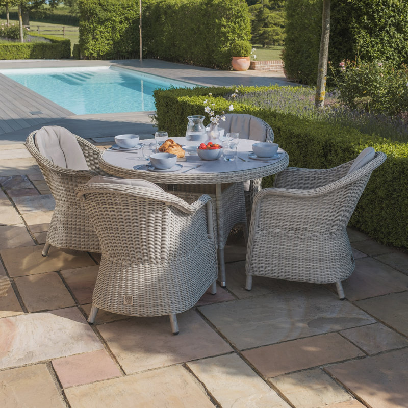 Anissah 4 - Person Patio Dining Set with Round Table