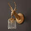 Lampe murale en laiton et cristal