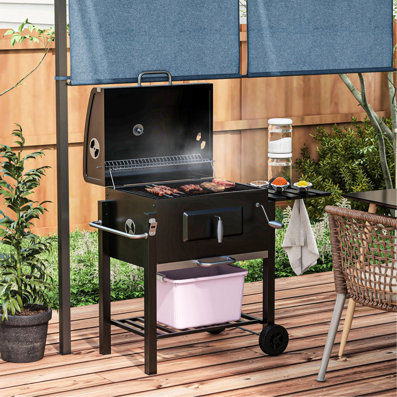Barbecue au charbon de bois, cuiseur extérieur portable pour les aventures de camping et de pique-nique. Surface de cuisson de 21,75 po x 16,5 po, table d'appoint, tablette inférieure, roulettes, poignée, noir. Easy Design Appliance. Rangement efficace