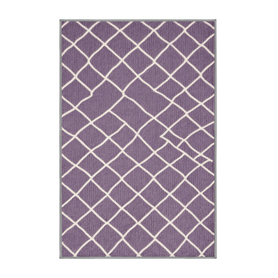 Tapis rose à motif treillis lavable à la machine
