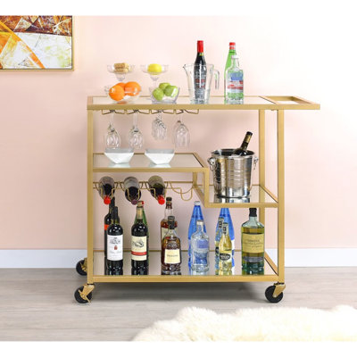 Chariot de service miroir fini champagne avec espace de rangement, miroir de 5 mm et plateau/étagères en contreplaqué de 3 mm, structure en métal, porte-verres à vin/verres à pied, 3 compartiments ouverts, charge maximale de 32 kg sur le plateau, charge maximale de 18 kg par étagère. Chariot à collations.