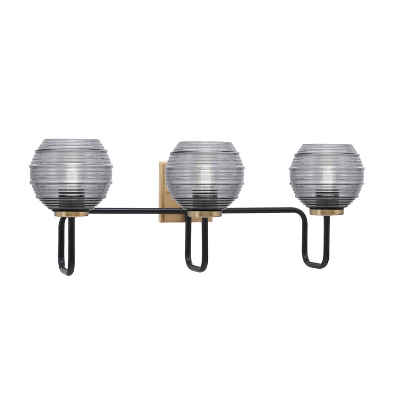 Barre d'éclairage de salle de bain 3 lumières Amarmula au fini noir mat et laiton vieilli, verre strié fumée 6 po