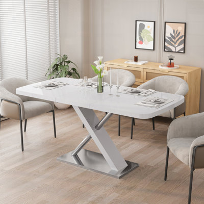 Table de salle à manger extensible avec base en métal croisée et tubes en acier inoxydable