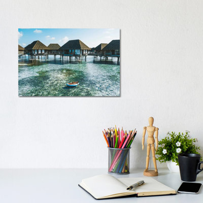 Maldives Resort Bungalows Girl Pool Float by James Vodicka - Wrapped Canvas Print