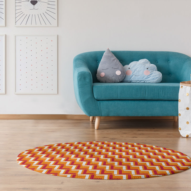 Tapis rond à motif géométrique orange / rouge