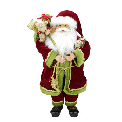 Père Noël rouge et vert avec des cadeaux de Noël