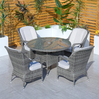 4 - Person Patio Dining Set with Oval Table , Cushions Included