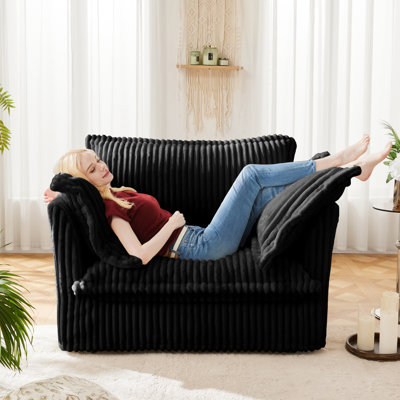 Fauteuil noir en velours côtelé et fauteuil élégant en tissu doux noir