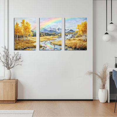 Ensemble de 3 tableaux sur toile tendue représentant un paysage d'automne avec arc-en-ciel et montagnes