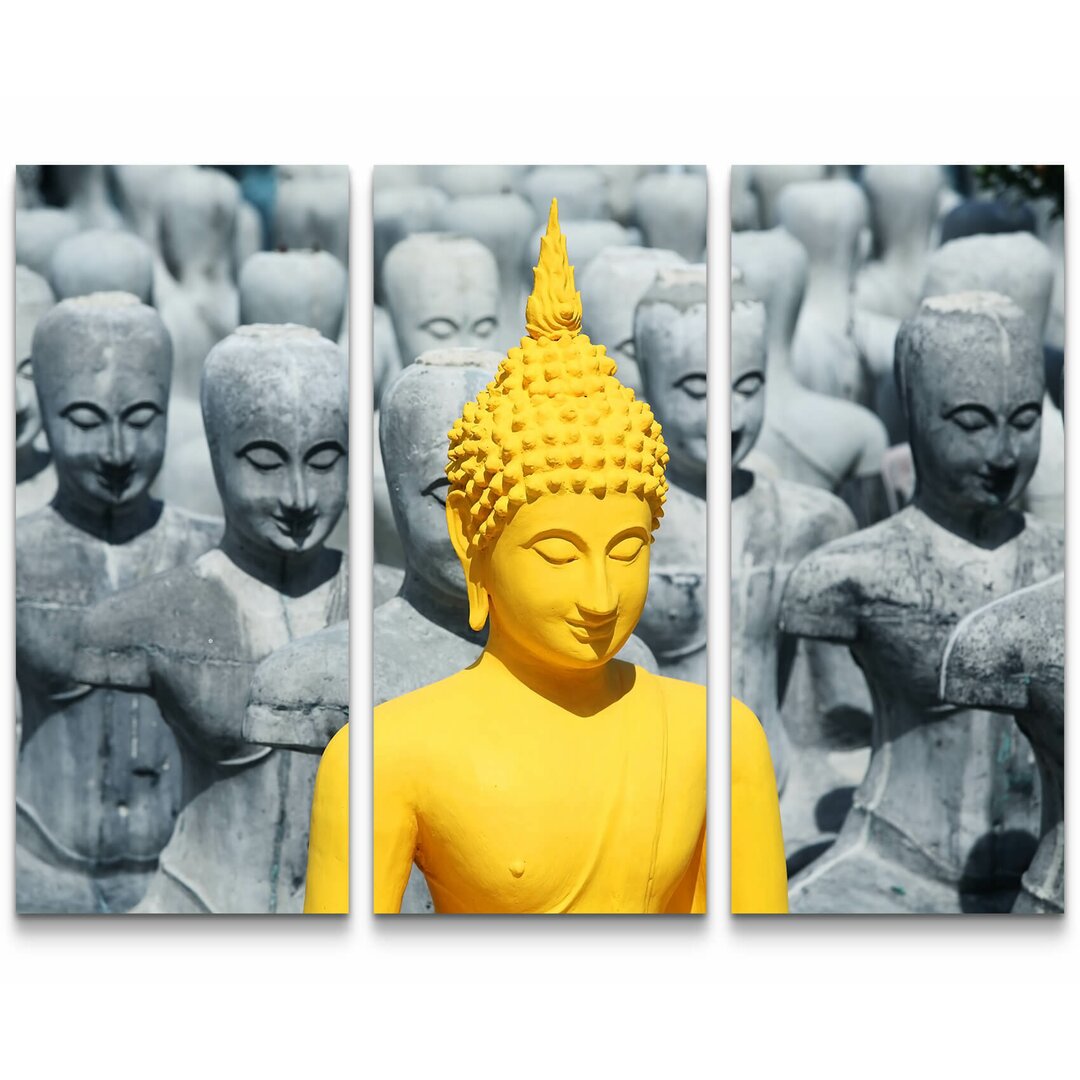 3-tlg. Leinwandbilder-Set Prächtige Buddhaskulptur zwischen grauen Statuen