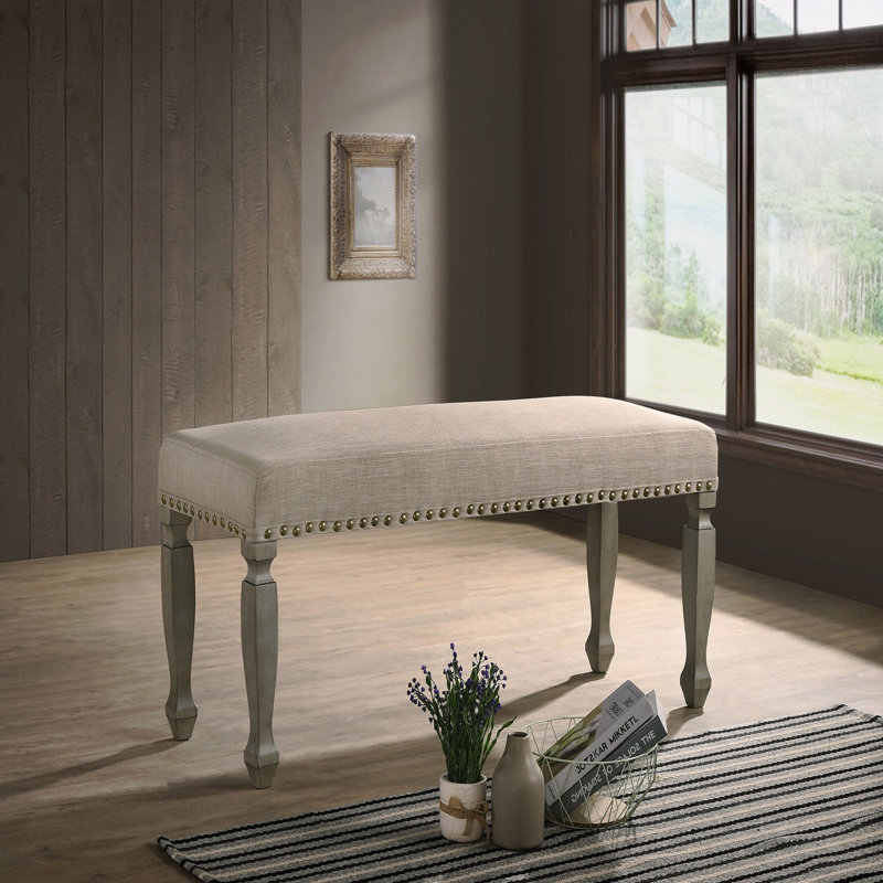 Banc rembourré à têtes de clou