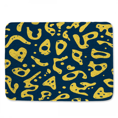 Tapis de bain jaune à formes abstraites