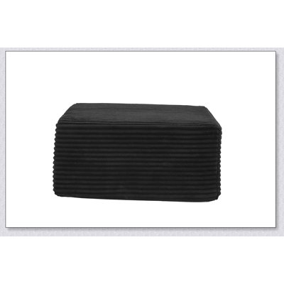 Pouf rembourré ergonomique avec dossier surélevé et poche de rangement latérale intégrée pour une détente optimale.