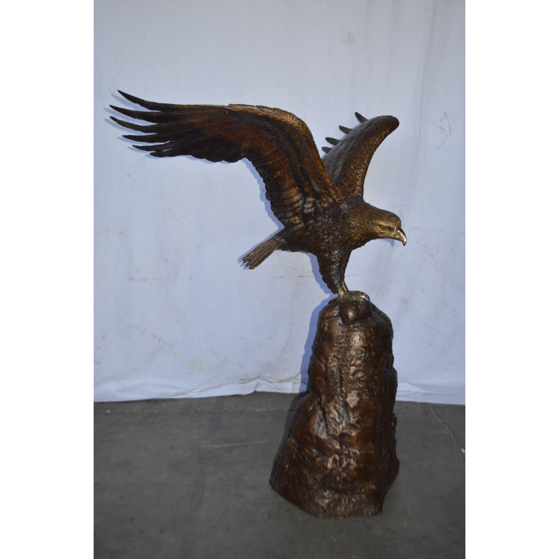 Eagle Landing On A Rock Bronze Statue - Size: 51"L X 36"W X 58"H.