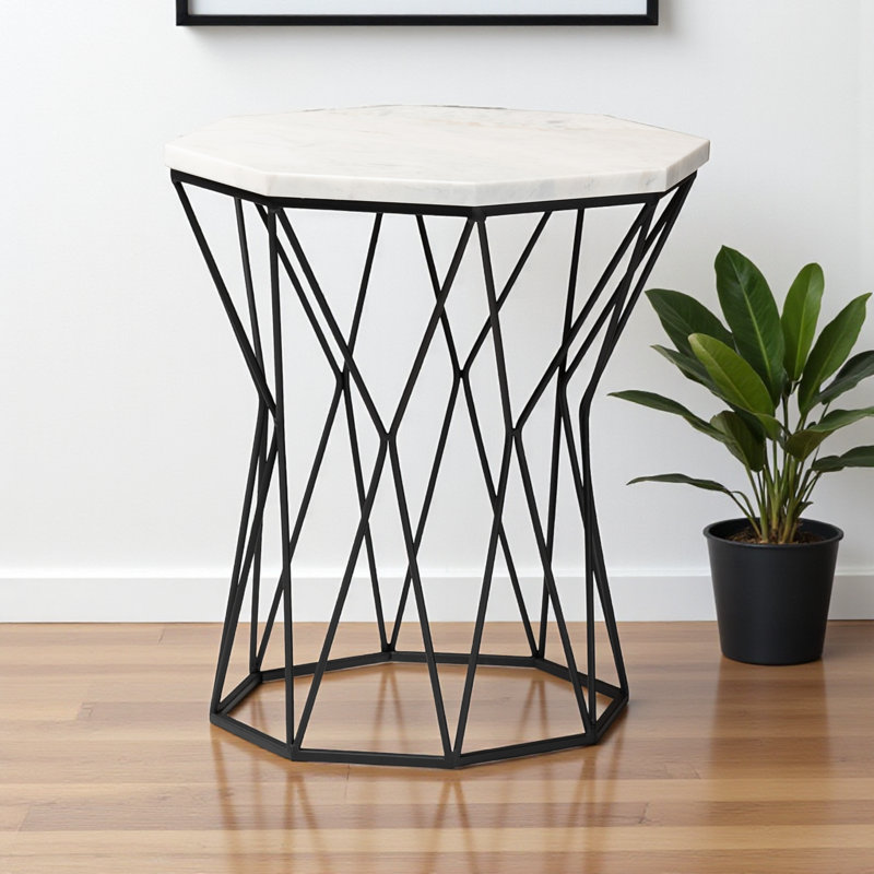 Galen is a modern and contemporary end table made of black metal and marble.