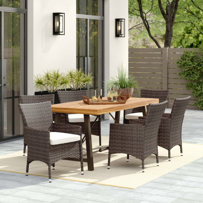 Tiggs 6 - Person Acacia Wicker Patio Dining Set with Rectangular Table , Cushions Included