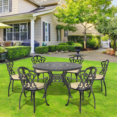 Ensemble de 7 pièces de mobilier de patio en aluminium coulé avec cadre noir et coussins de siège blanc cassé