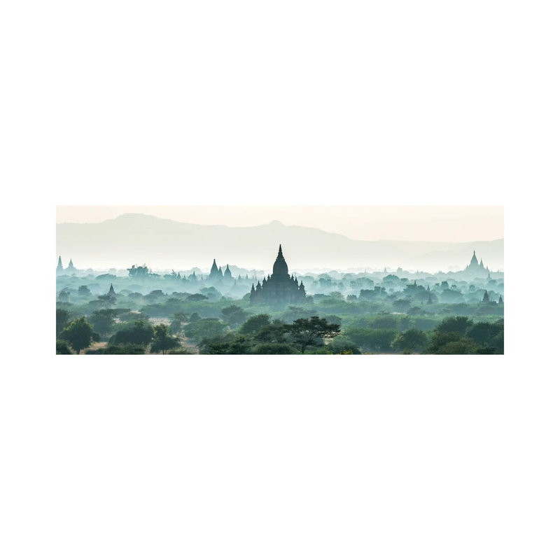 Early Morning Fog Over The Temples In Bagan, Myanmar by Jan Becke - Wrapped Canvas Panoramic Print