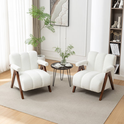 Fauteuil Dormon rembourré avec pieds en bois massif