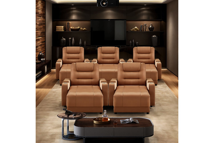Home theater with five brown leather theater chairs, two in the front row and three in the back row.