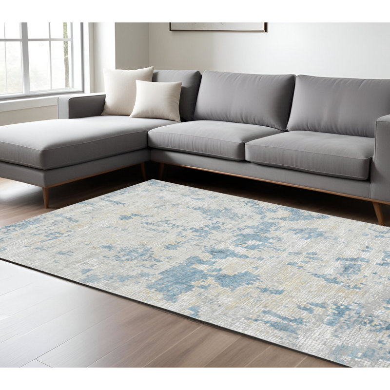 Tapis abstrait ivoire et bleu ciel 8 pi x 10 pi