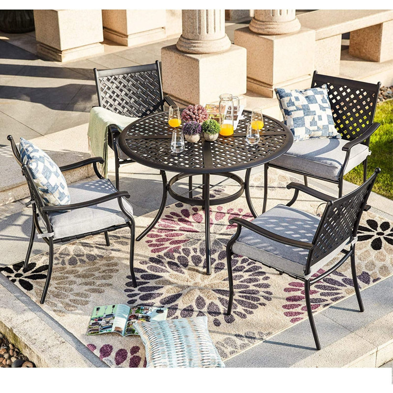 Rhyanne 4 - Person Patio Dining Set with Round Table , Cushions Included