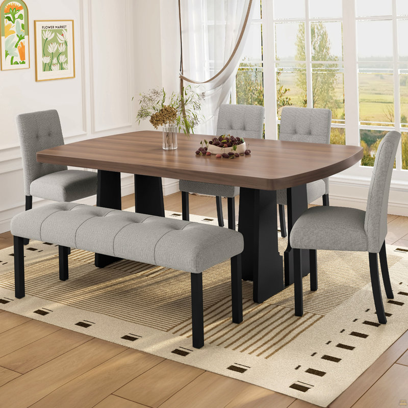 Ensemble de salle à manger moderne de 6 pièces : table de 160 cm avec pattes géométriques, 4 chaises rembourrées et 1 banc. Convient à la cuisine ou à la salle à manger. Montage facile. Table en noyer et noir avec assises grises.