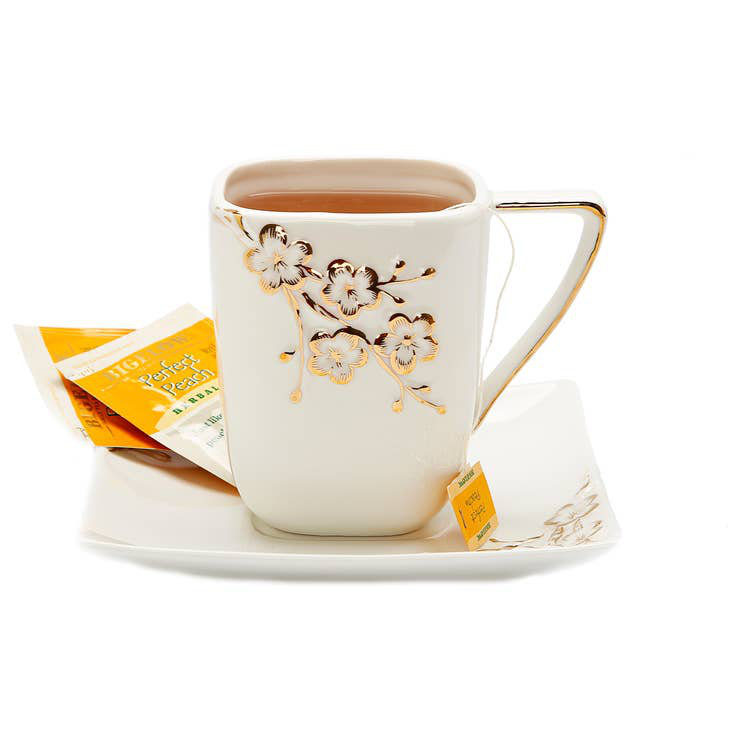 Plateau carré blanc et tasse avec motif floral doré