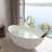 Crestone 67" x 33.5" Freestanding Soaking Solid Surface Resin Stone Bathtub with Black Bath Pollow