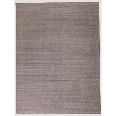 Puja Hand Loomed Area Rug in Brown