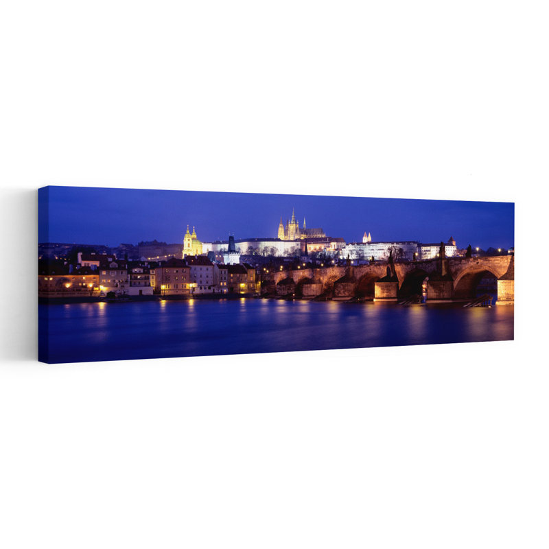 Bridge Across A River Lit Up At Night Charles Bridge Vltava River Prague Czech Republic by Murat Taner - Wrapped Canvas Panoramic Print