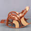 Chaise berçante en rotin naturel