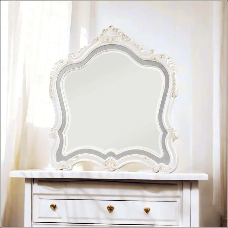 Miroir exquis avec bord biseauté, bordure ornementale à volutes et couronne