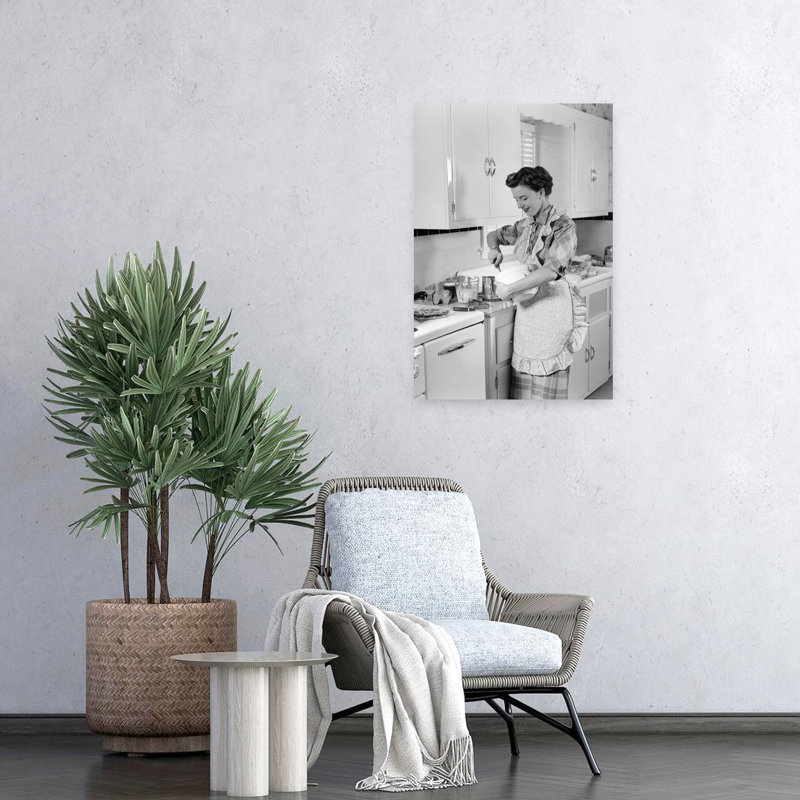1950s WOMAN HOUSEWIFE IN KITCHEN APRON MIXING BAKING INGREDIENTS IN BOWL by H. Armstrong Roberts - Wrapped Canvas Print
