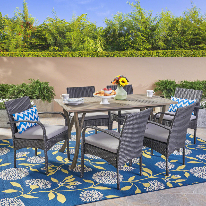 Belora 6 - Person Acacia Wicker Patio Dining Set with Rectangular Table , Cushions Included