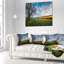 Coussin vert pastel sous un ciel bleu-393691060-393684250