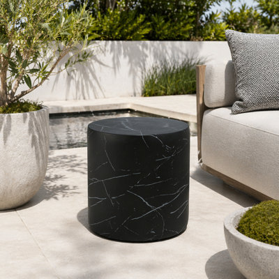 Table d'appoint cylindrique en béton léger avec finition en marbre noir