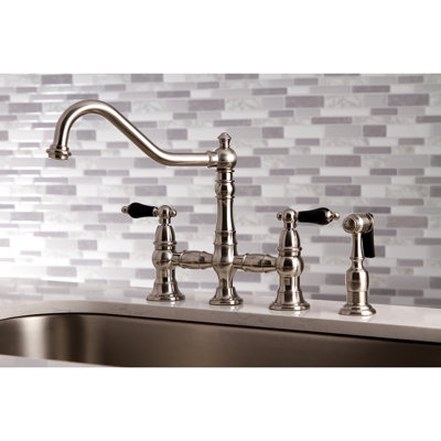 Kingston Brass Duchess Two-Handle 4-Hole Deck Mount Bridge Kitchen Faucet with Brass Side Sprayer