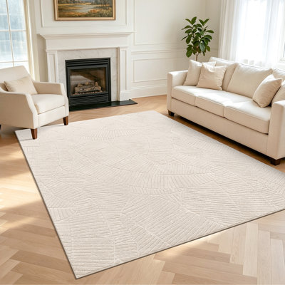 Tapis beige en sherpa beige, tapis à feuilles tropicales