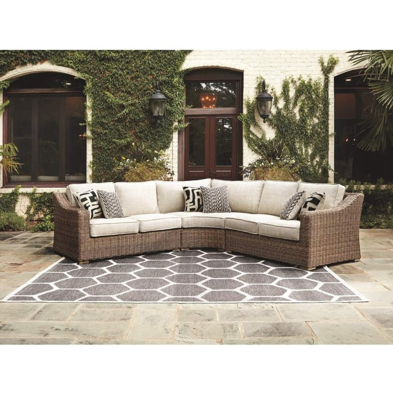 Chaise de coin d'extérieur incurvée beige avec coussins et coussins