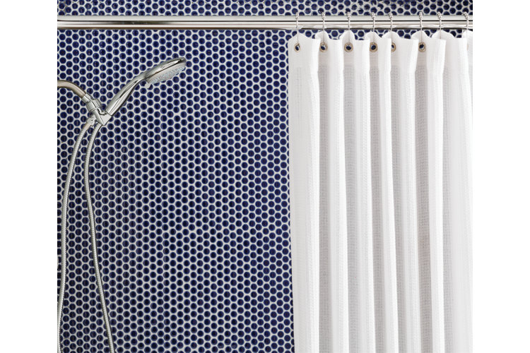 side view of a shower with a handheld showerhead