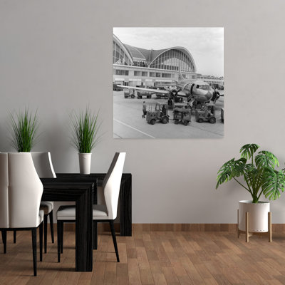 1950s 1960s PROPELLER AIRPLANE ON AIRPORT TARMAC IN FRONT OF TERMINAL WITH MODERN ARCHED WINDOWS ST. LOUIS MISSOURI USA by C. S. Bauer - Wrapped Canvas Print